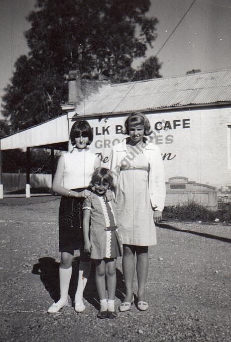 Suzanne and Maxine Williams (and unknown) outside Thornton’s Mixed Business with the George and Annie Bills horse trough behind them.